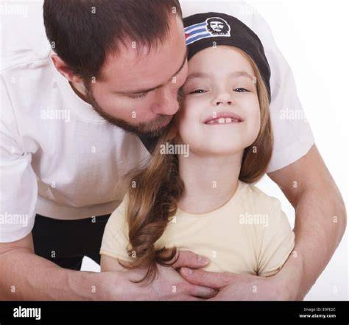 A man hugs his daughter | Source: Shutterstock