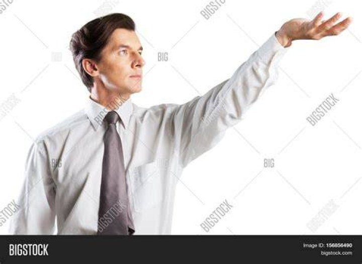 A man with his hand covering his face | Source: Getty Images
