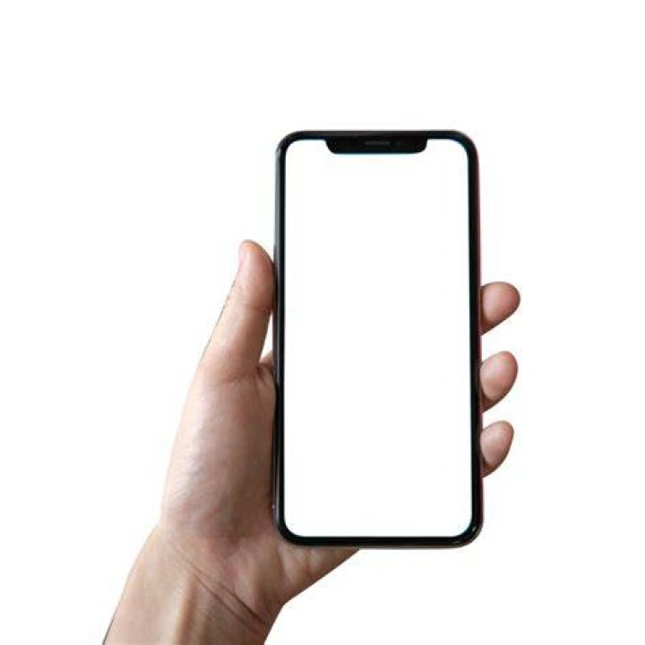 A person holding a phone | Source: Shutterstock