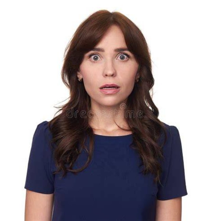 A shocked woman looking at a man | Source: Shutterstock