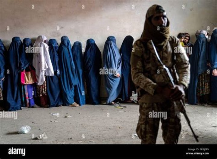 A Taliban fighter stands guard during Friday prayers in the Abdul Rahman Mosque in Kabul, Afghanistan on July 29, 2022