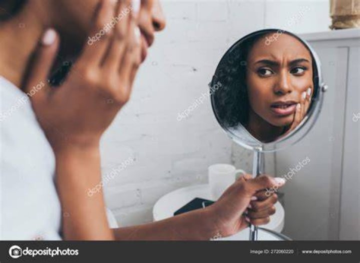 A woman looking at a couple in bed | Source: Shutterstock
