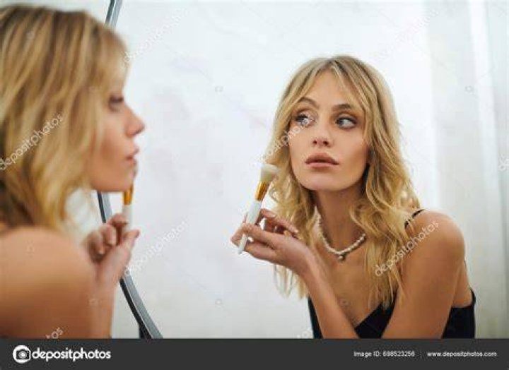 A woman looking at her phone. | Source: Getty Images