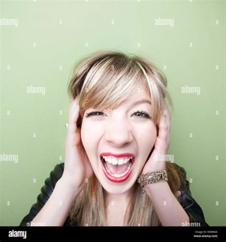 A young woman screams at a teen girl | Source: Shutterstock
