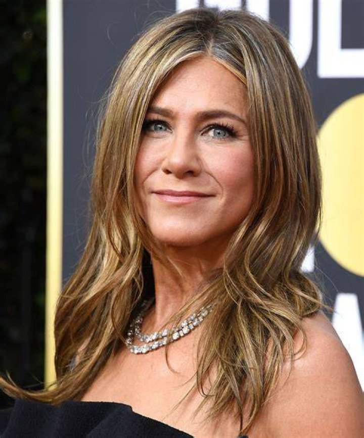 Actress Jennifer Aniston who was honored with a star at the Hollywood Walk Of Fame is pictured with her father actor John Aniston on February 22, 2012 in Hollywood, California ┃Source: Getty Images