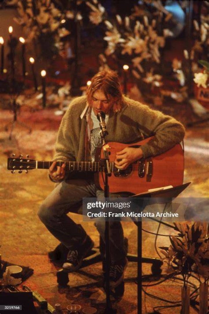 American singer and guitarist Kurt Cobain (1967 - 1994), performs with his group Nirvana at a taping of the television program 'MTV Unplugged,' New York, New York, Novemeber 18, 1993 | Photo: Getty Images