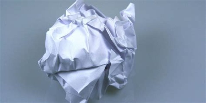 An crumpled up $1.00 bill. | Source: Shutterstock