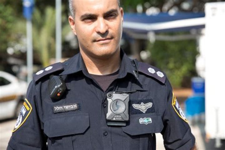 An Israeli police officer works at the scene following an incident in Elad in central Israel, May 5, 2022.