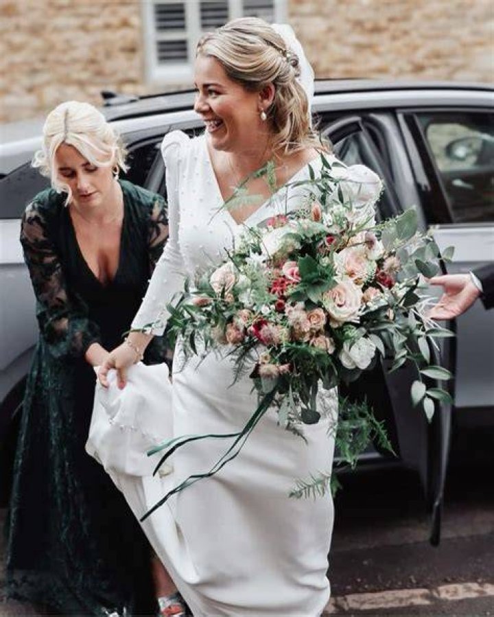 Arriving in style: The bride was driven up to the church in a black Rolls-Royce Cullinan