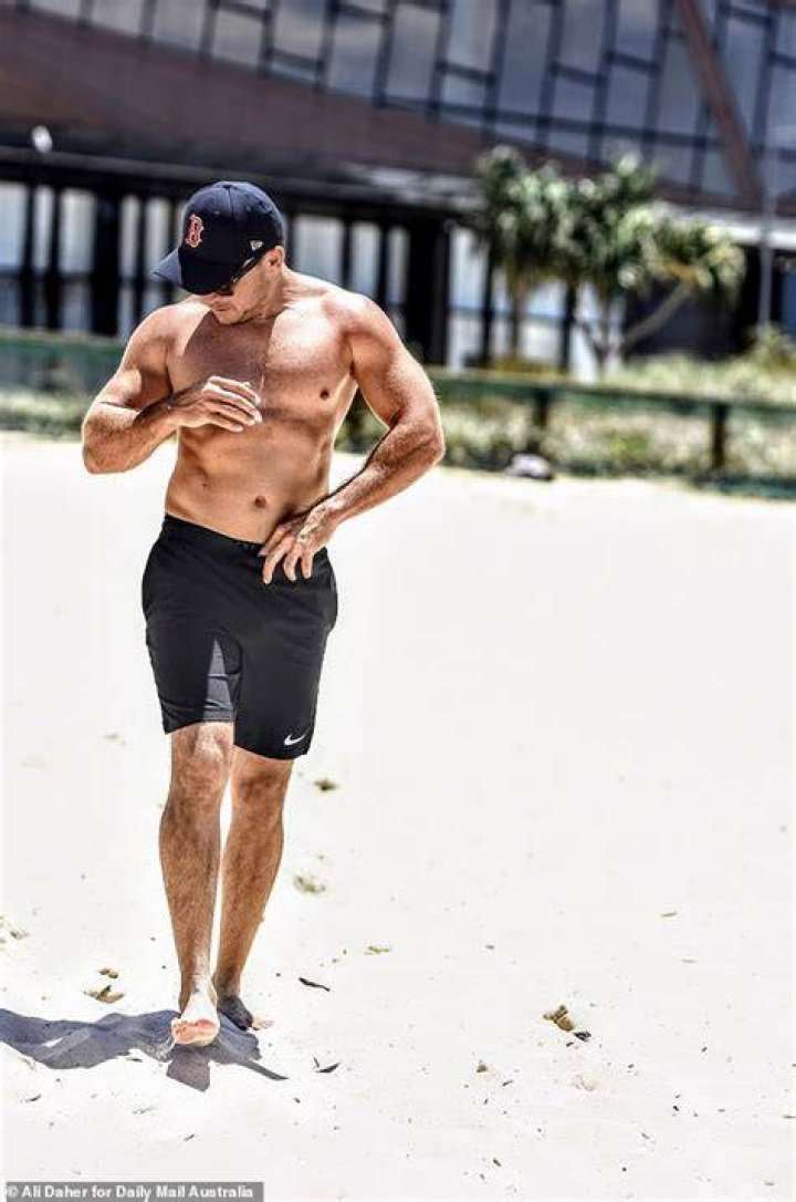 Bear showed off his toned chest as he wandered around naked