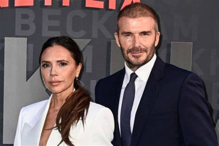 Beckhams: David's father Ted and Hilary were seen heading out on to the balcony after their arrival