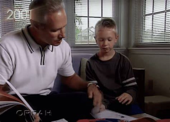 Ben helps Bryan with his school work. | Source: