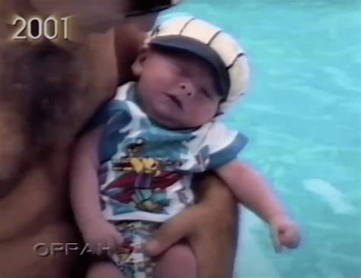 Ben pictured holding Baby Bryan. | Source: