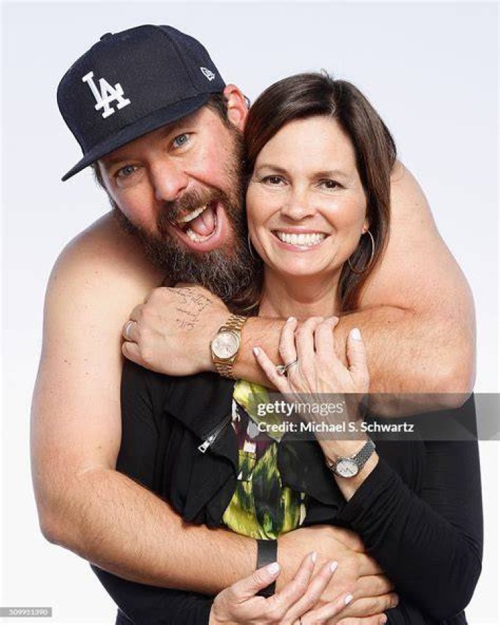Bert Kreischer (L) poses with his wife Leann Kreischer after his performance at The Ice House Comedy Club, on February 12, 2016, in Pasadena, California. | Source: Getty Images