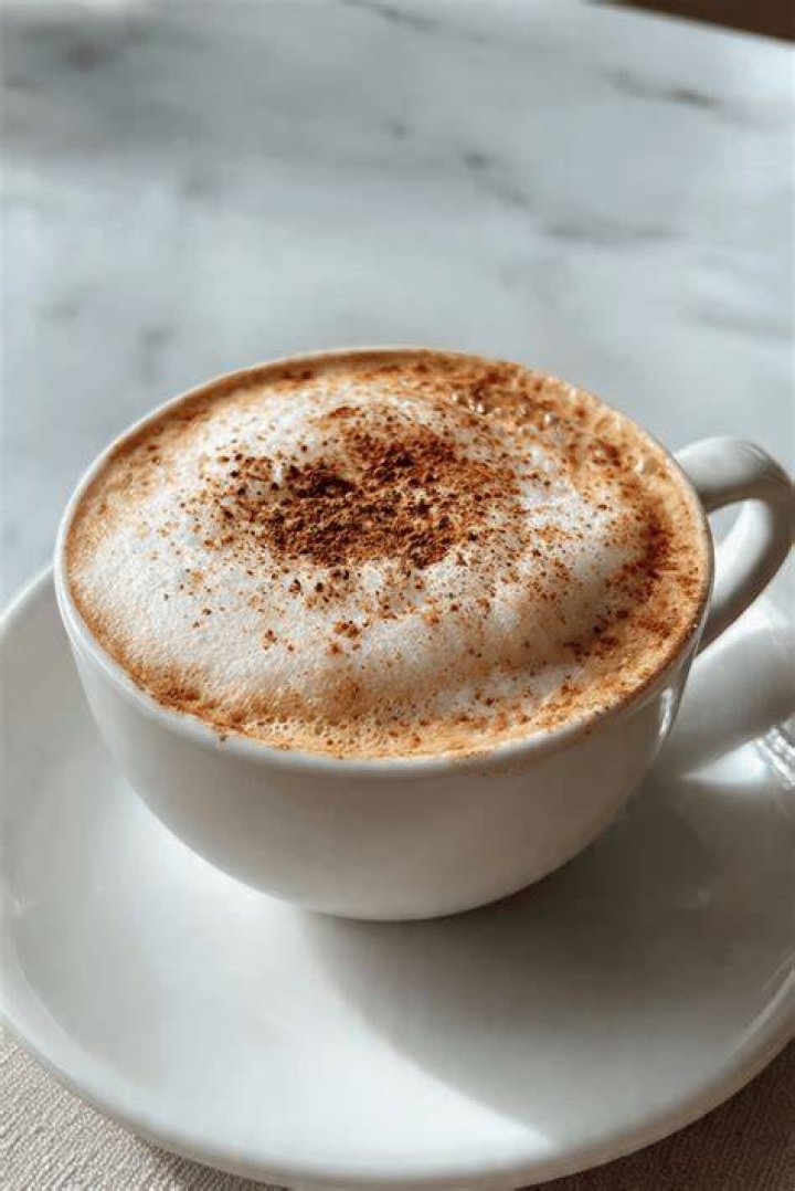 Breakfast is an almond cappuccino, crumpet toast with Nuttelex lite and maple syrup spread on top