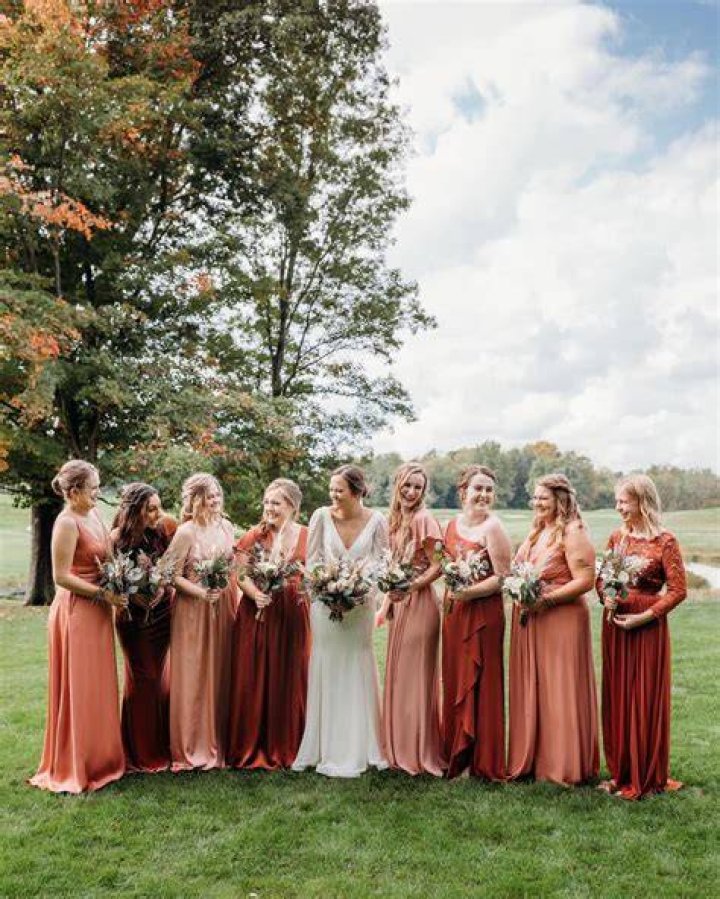 Bridesmaids: Harper and two other bridesmaids waved as they stood on the balcony with other guests
