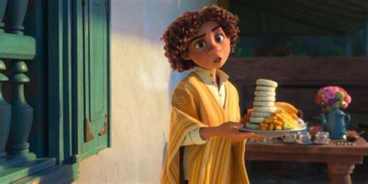 Camilo carrying dishes in Encanto.