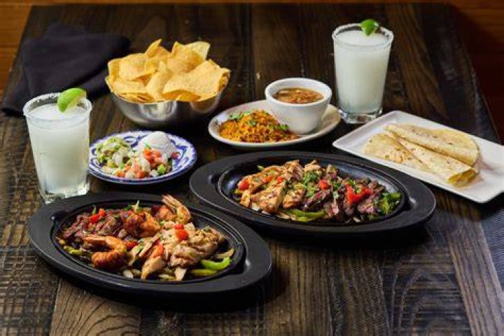 cantina laredo fajitas with side of guac and pico de gallo
