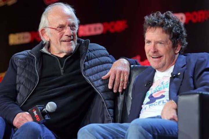 Christopher Lloyd (L) and Michael J. Fox attend a "Back To The Future Reunion" panel at New York Comic Con on October 08, 2022 in New York City | Source: Getty Images