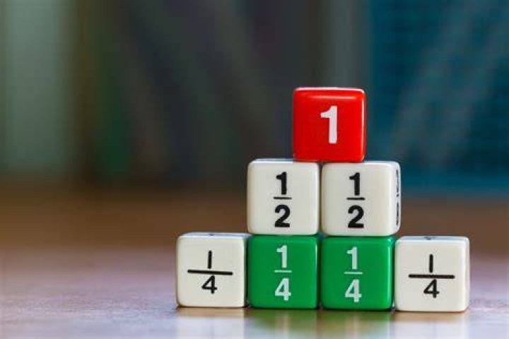 Colorful fraction dices stacked up on top of each other | Source: Shutterstock