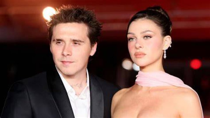 Congratulations! Brooklyn Beckham and Nicola Peltz have tied the knot (pictured during ceremony) in a stunning early-evening ceremony beside the ocean surrounded by celebrities including tennis legend Serena Williams