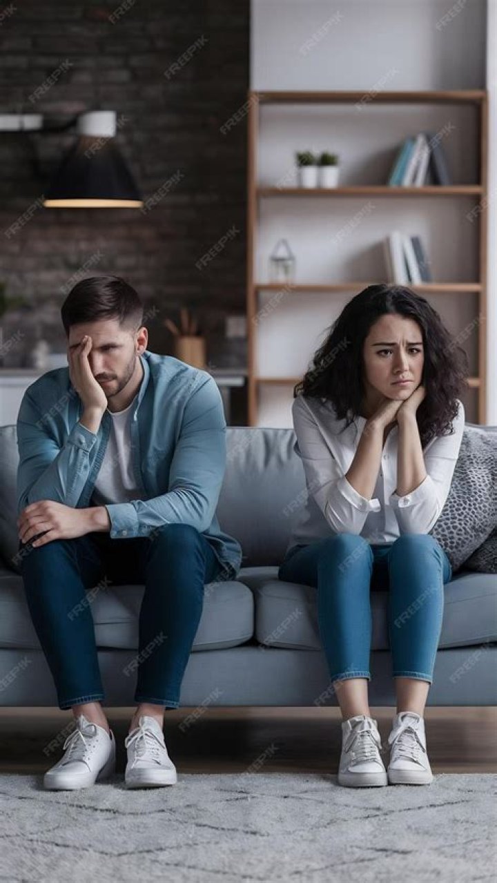 Couple sitting apart after an argument | Source: Shutterstock