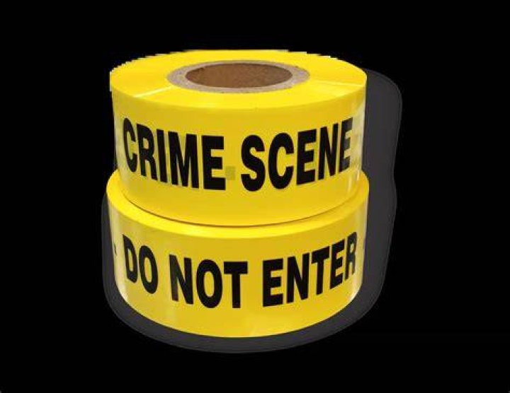 Crime scene tape in building. | Photo: Shutterstock