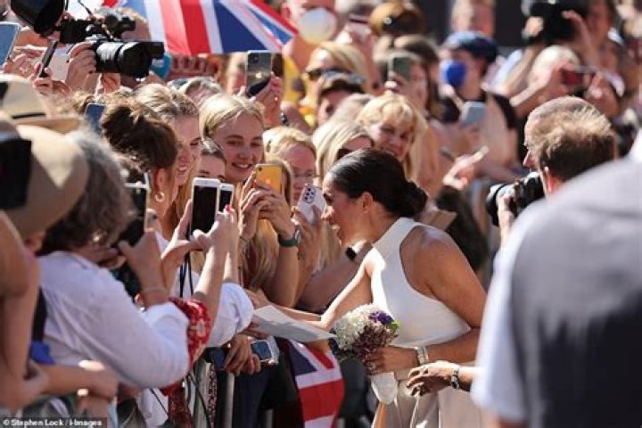Crowds: The pair attracted a lot of attention on their trip out as fans gathered outside the Dolce and Gabbana store to take pictures of them as they headed inside