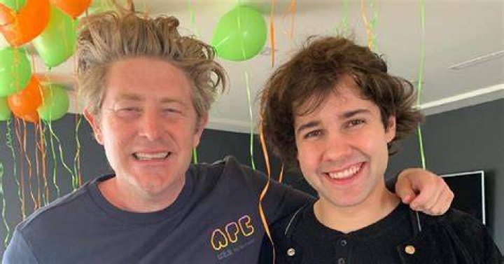 David Dobrik and Jason Nash shacking hands after receiving the news of the wedding | Source: YouTube/David Dobrik