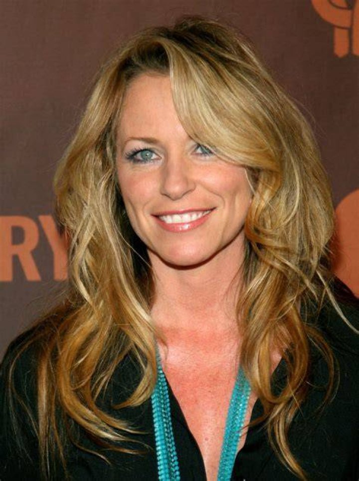 Deana Carter posing a picture with her husband Jim McPhail