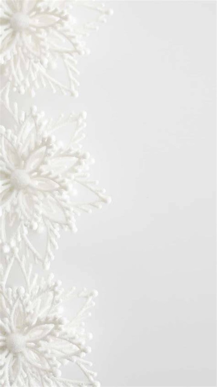 Design: There were white floral arrangements on the tables