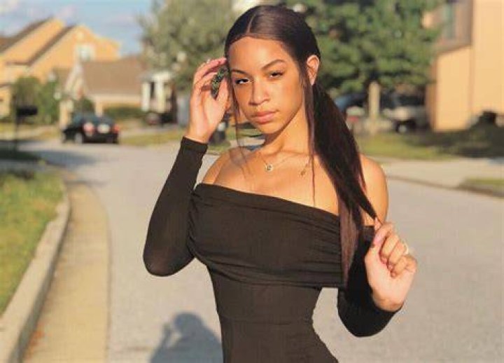 Deyjah Harris showing her arm tattoo with images of the sun and moon. | Photo: