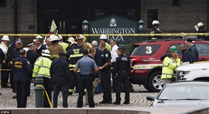 Emergency personnel gather after a deadly shooting on Sunday, July 17, 2022, at the Greenwood Park Mall. Photo / AP