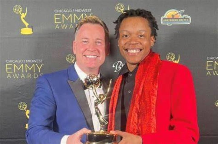 Emmy was raised as an only-child by her non-biological parents Greg and Sharon