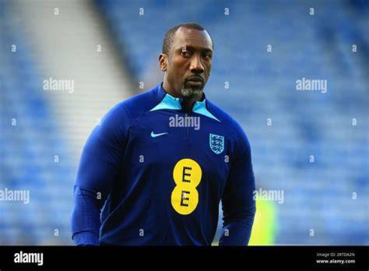 England football coach Jimmy Floyd-Hasselbaink responded to Harriman, saying he'd asked the shop's owner in 2020 to take down the image