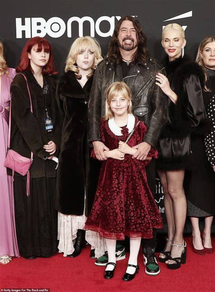 Family affair: Grohl was joined by his daughters Violet, 15, Harper, 12, and Ophelia, seven, as well as his wife Jordyn Blum