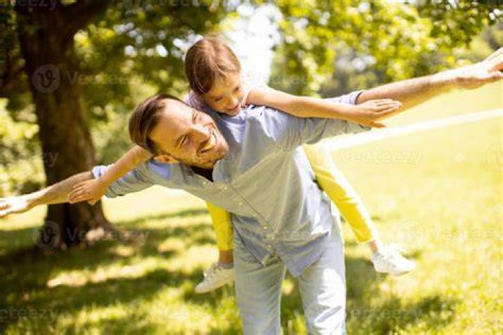 Father and daughter having fun while reading a fairy tale book. | Photo: Pexels