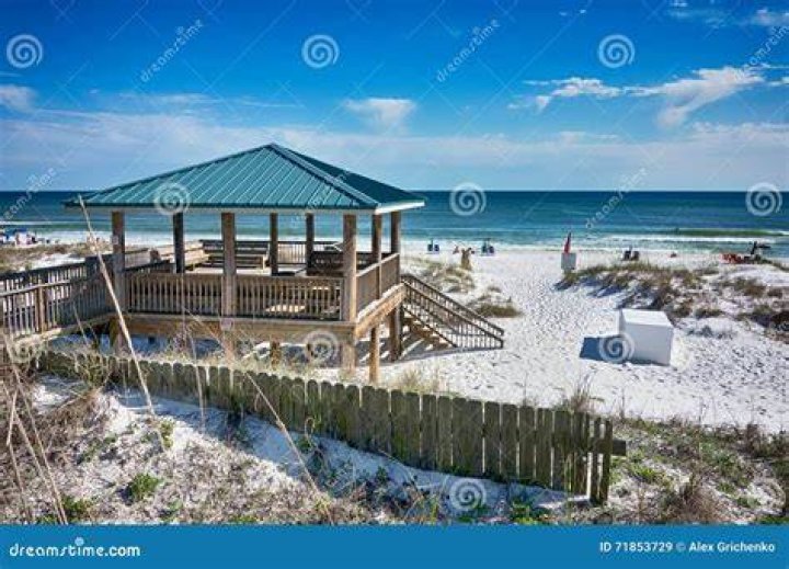 Florida: In scenes that only happen in places like uber-wealthy Palm Beach, people driving a Rolls stopped to lower their window to ask: ‘What’s going on?’. Pictured: Guests on the balcony