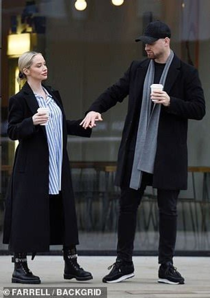 Gent: Meanwhile, Connor also bundled up wearing a long black overcoat along with a pair of black jeans and a grey scarf. He finished his look with joggers and a cap