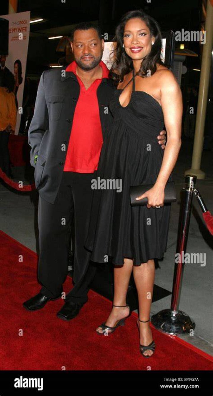Gina Torres and Laurence Fishburne at the 46th NAACP Image Awards Arrivals at a Pasadena Convention Center on February 6, 2015 | Photo: Getty Images