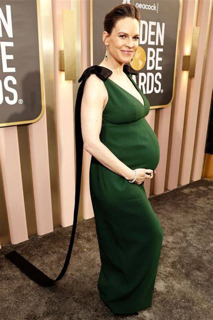 Golden Globes 2023 Pregnant Claire Danes looks ethereal in a plunging white gown with a pink