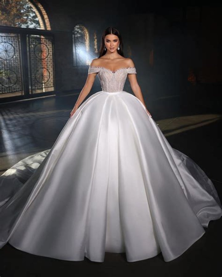 Gown: The dress was created over the last few months by Suzanne's team, with each floral detail placed and hand sewn individually
