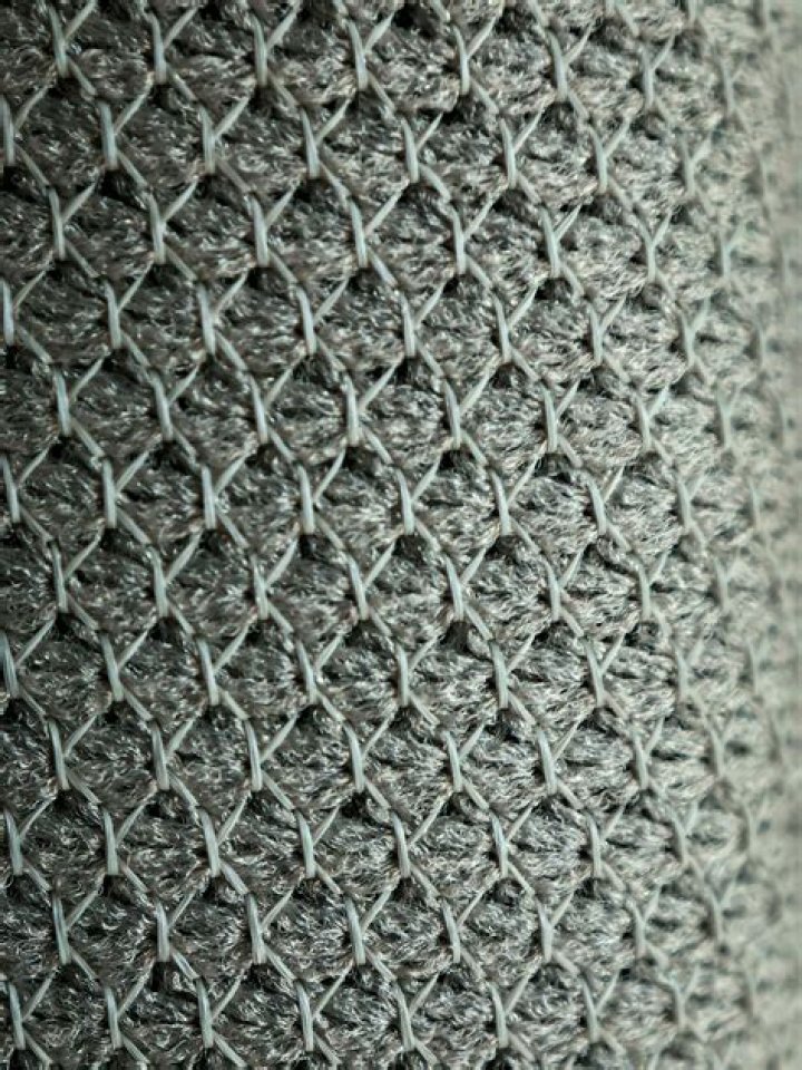 Grey and black knit textile | Source: Unsplash / Sahand Hoseini