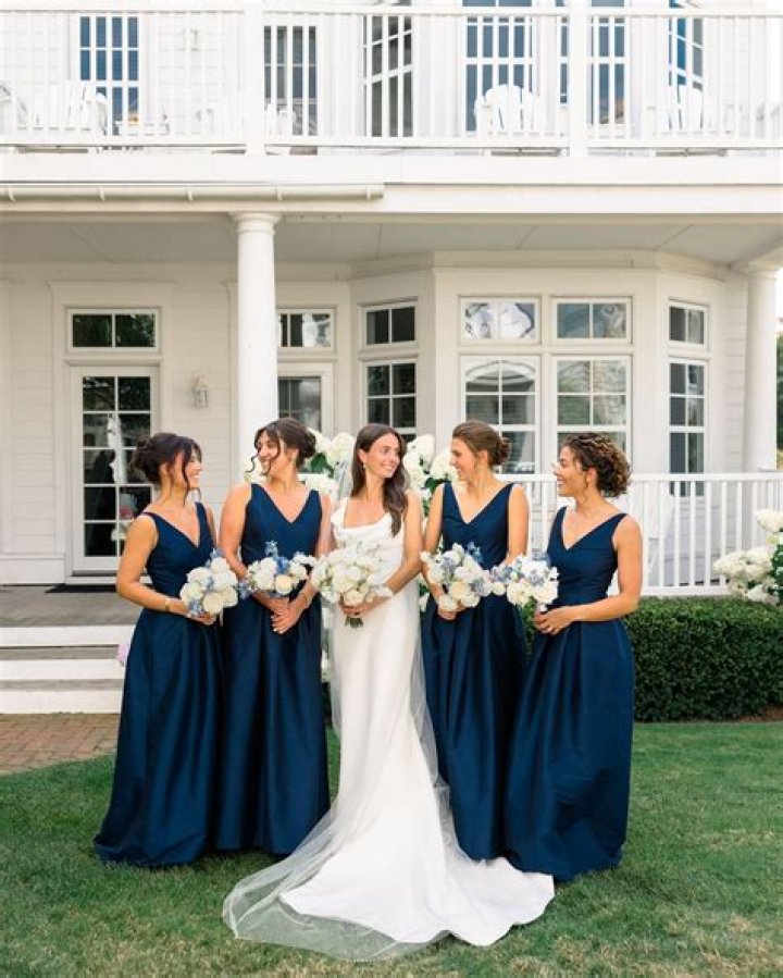 Harper: The bridesmaids wore white dresses and floral garlands, while they held flower bouquets