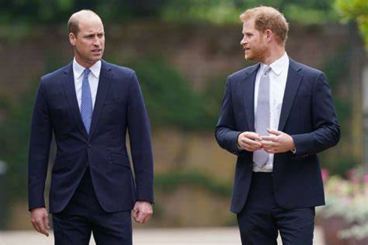 Harry and William stand together during the unveiling of a statue they commissioned of their mother Diana in the Sunken Garden at Kensington Palace, London, July 1, 2021