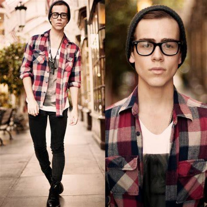 Hipster style: Joel had on a pink beanie to cover up his long hair, and wore his dark sunglasses over the top