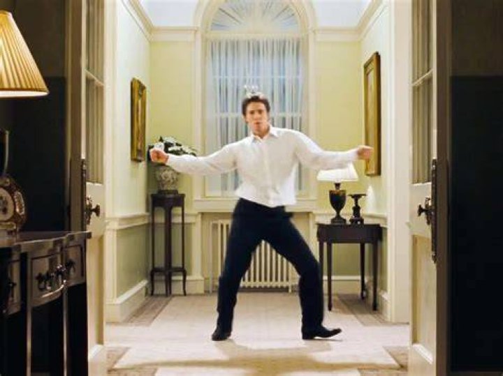 Hugh Grant dancing through 10 Downing Street in the film "Love Actually." | Source: YouTube/Movieclips.