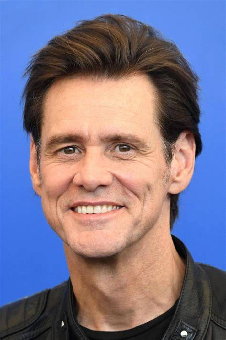Jim Carrey having a great time with Melissa Womer and their daughter, Jane Carrey, in 1991. | Source: Getty Images
