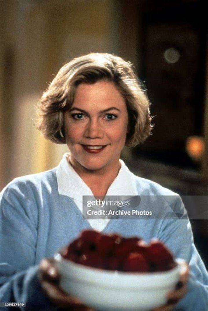 Kathleen Turner holding a bowl of fruit in a scene from the film "Serial Mom" released 1994. | Source: Getty Images