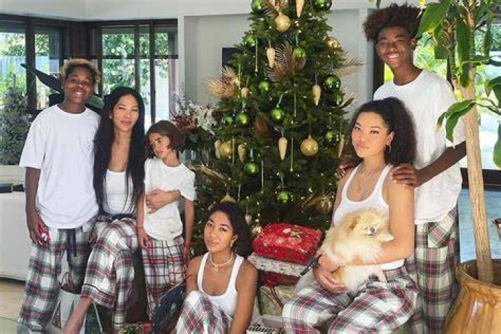 Kimora Lee Simmons and her sons Gary, Wolfe, and Kenzo | Source: Getty Images,